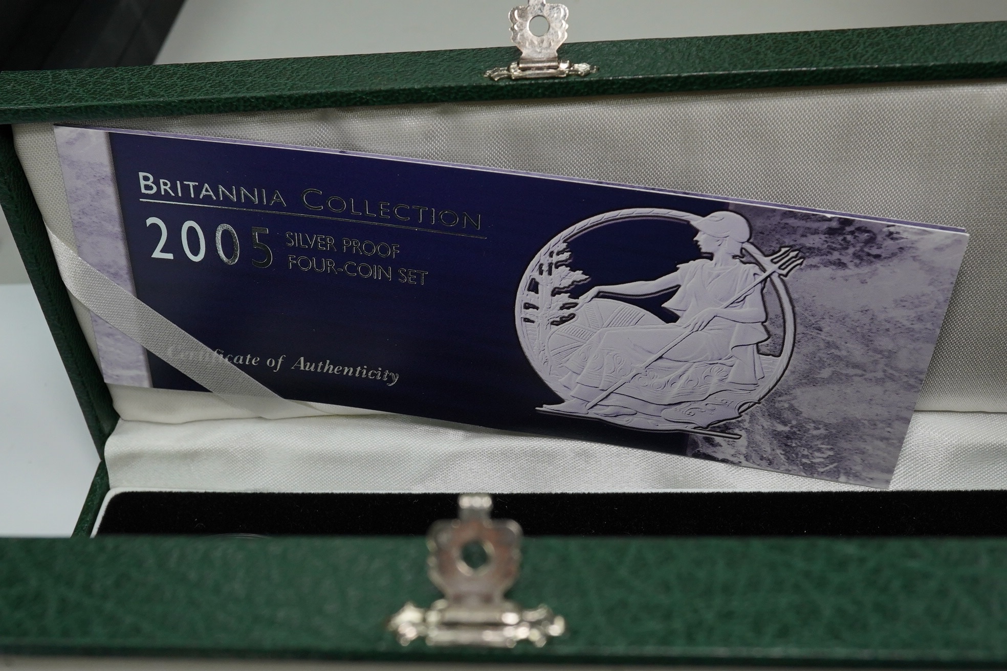 Royal Mint UK QEII coins, four Britannia collection silver proof four-coin sets, 1997, 2001, 2005 and 2007, in case of issue with certificate (4)